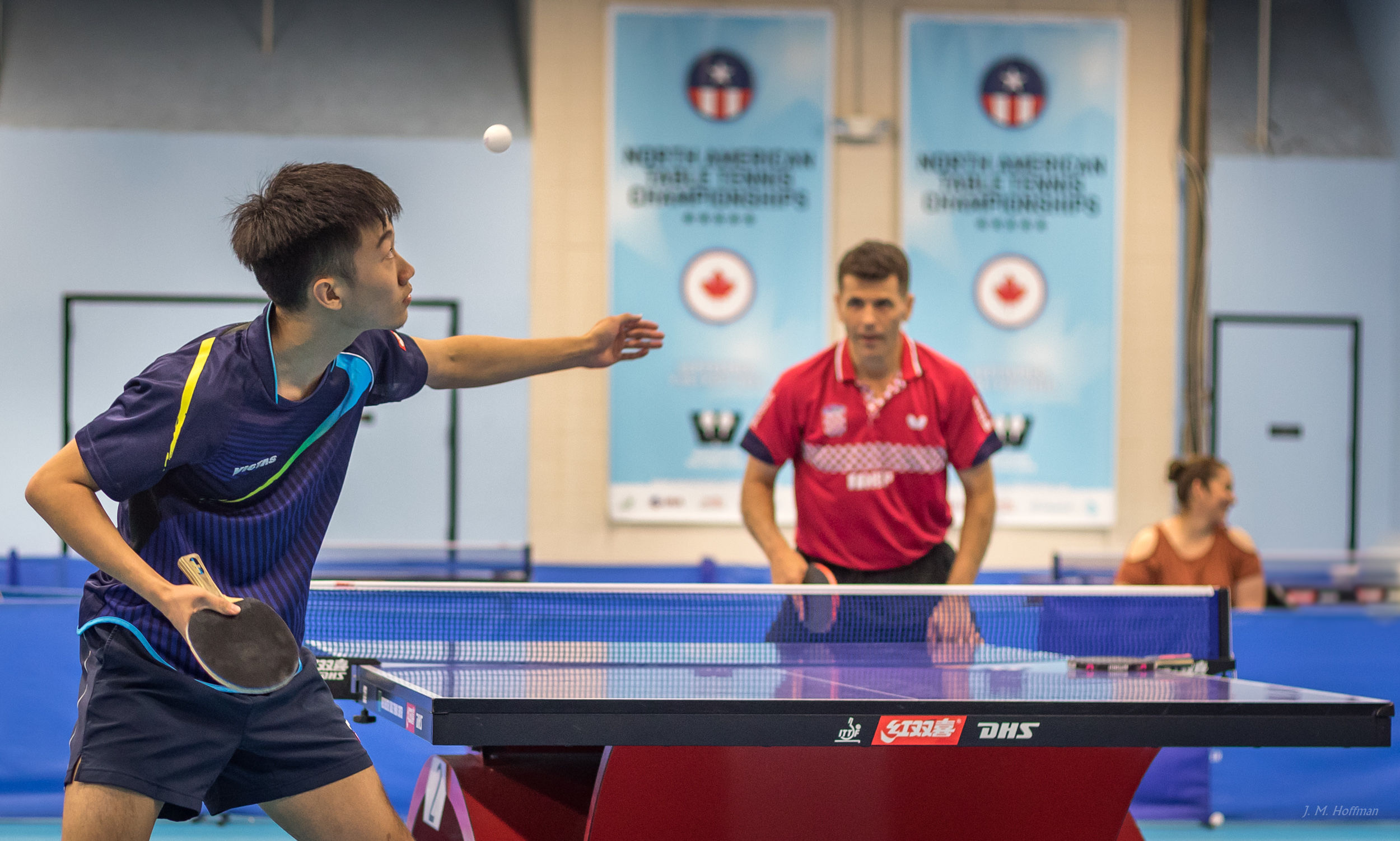 Kai serves to Zoran in an exhibition game.: 